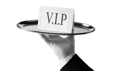 A VIP card presented on a silver tray.